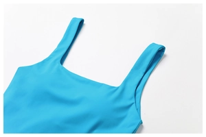 Detail of square neck sport dress with wide straps and smooth blue elastic fabric