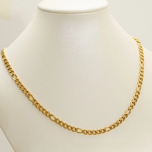 Close-up of 18K gold plated stainless steel Figaro chain necklace on a white bust