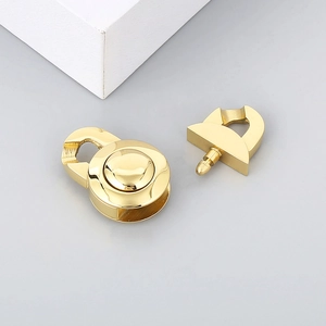 Detailed view of two gold stainless steel jewelry clasps for DIY chain accessories