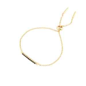 Adjustable gold bolo bracelet with blue cubic zirconia stones for a minimalist look