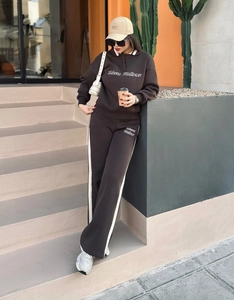 Detail of retro polo collar sweatshirt and side-stripe sweatpants in deep brown finish