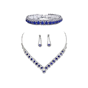 Silver jewelry set with blue zircons featuring necklace, earrings and bracelet