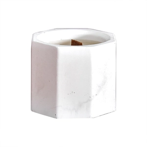 Handmade soy wax aromatherapy candle in hexagonal marble jar with wooden wick