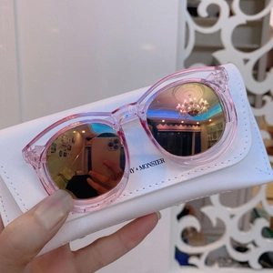 Pink round frame kids sunglasses with reflective lenses and white leather pouch