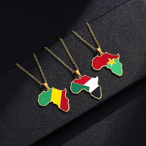 Detail of African map pendant necklaces with Mali Sudan and Burkina Faso flag enamel
