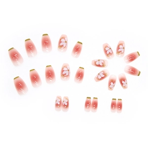Pink ombré ballerina press-on nails with white floral patterns and gold accents