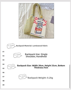 Detail view of large striped plush tote bag showing soft fabric texture and dimensions