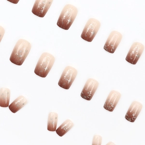 Amber gradient press-on nails with silver star patterns and glitter in short square shape