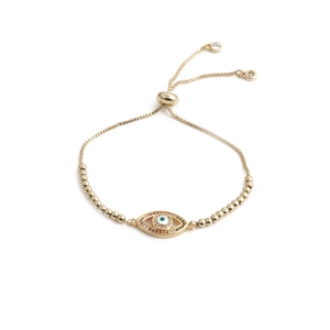 Detail of gold evil eye bracelet with adjustable sliding clasp and beaded chain