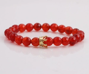 8mm red faceted stone bead bracelet for men with a golden crown charm centerpiece