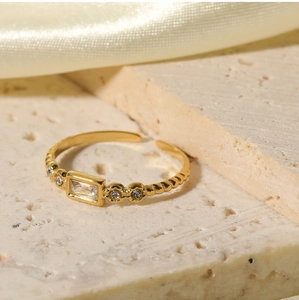 Macro view of 18K gold plated stainless steel ring with rectangular white zircon stone
