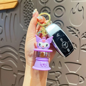 Cartoon Kuromi keychain with purple night light feature held with car keys in hand