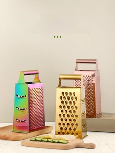 Detailed view of 4-sided stainless steel graters in colorful, gold, and rose gold finishes