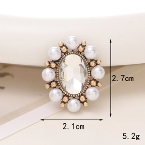 Macro detail of vintage pearl lady portrait charm with 2.7cm x 2.1cm dimensions