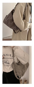 Close-up of suede texture shoulder bag with adjustable strap and metal zipper detail