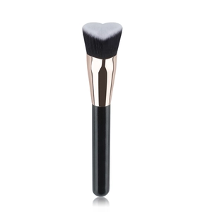Detailed view of the heart-shaped foundation brush with soft dual-tone synthetic bristles