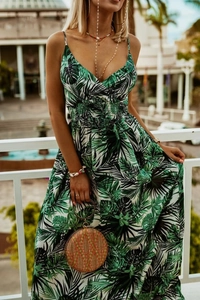 Detail of V-neck tropical floral maxi dress with high-waisted pleats and thin straps