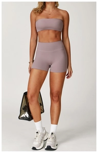 Vertical shot of smoky purple brushed yoga set showing high-waist shorts and sports bra top