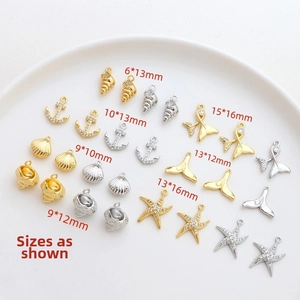 Macro detail of 14k gold plated marine charms with zircon inlay and exact dimensions