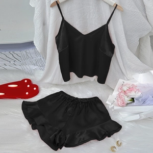 Two-piece black satin sleepwear set with V-neck camisole and ruffled drawstring shorts