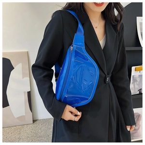 Blue glossy PVC crossbody bag shown on a black suit jacket for color contrast