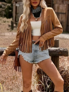 Detail of brown suede jacket with metal studs and long fringe in western style