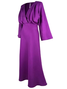 Detail of the deep V-neckline and draped pleats on a long-sleeved purple dress