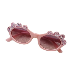 Pink candy-colored glitter sunglasses for kids with oval cartoon frames and sparkles