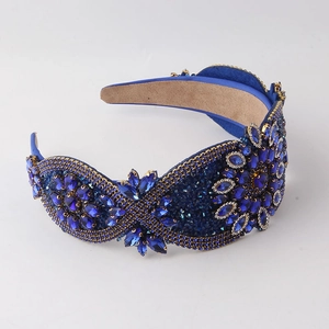 Detail of baroque wide headband featuring blue crystals and rhinestones on velvet lining