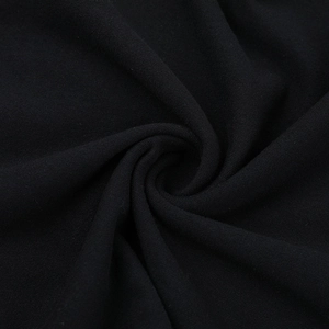 Macro detail of high-quality black woven fabric texture with elegant spiral drapery
