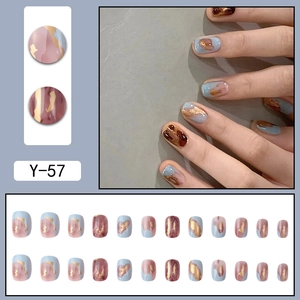 Short round press-on nails in Morandi blue and wine red with gold foil accents