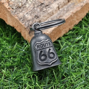 Detailed macro view of the vintage silver Route 66 motorcycle bell with relief engraving