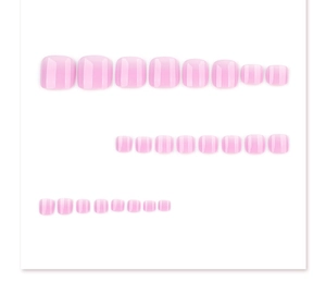 Macro view of pink gradient press-on toenails with textured jelly finish on white background