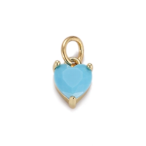 Detailed close-up of light blue heart-shaped crystal pendant with gold metal base