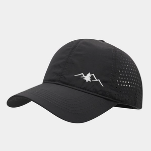 Macro view of laser-cut eyelets and quick-dry fabric on this outdoor sports baseball cap