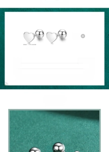 Close-up of S925 sterling silver heart stud earrings with size and weight specs