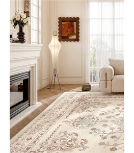 Detail of vintage French pattern carpet with floral swirls in a beige luxury living room