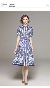 Detail of blue and white porcelain print dress with shirt collar and waist belt detail
