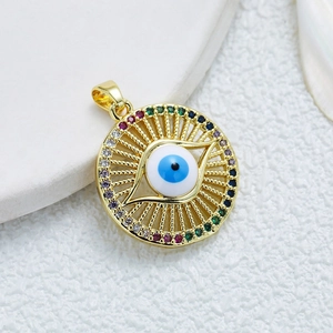 Gold evil eye pendant necklace with colorful zircons and blue enamel center on white background