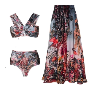 Detailed view of women's three-piece swimwear set with vintage tropical floral print