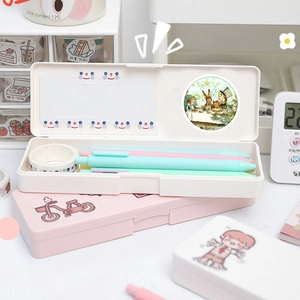 Detail of Alice in Wonderland stickers inside a minimalist stationery pencil box set