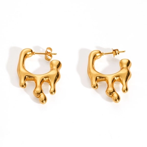 Detailed macro view of 18K gold plated stainless steel fluid lava drip style earrings