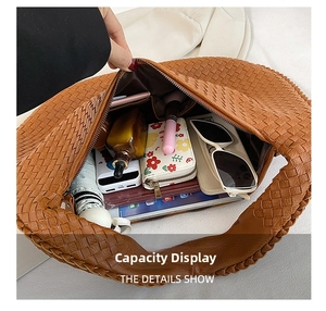 Detailed interior of a brown woven shoulder bag showing spacious storage for daily items