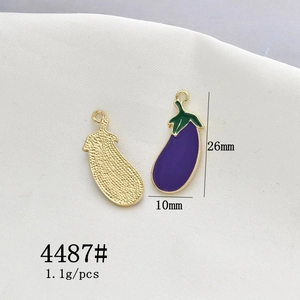 Macro detail of eggplant alloy pendants showing 26x10mm size and enamel finish