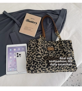 Large capacity leopard print tote bag shown with tablet and phone for size comparison