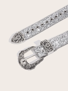Detail of silver glitter belt featuring vintage carved buckle and star-shaped eyelets