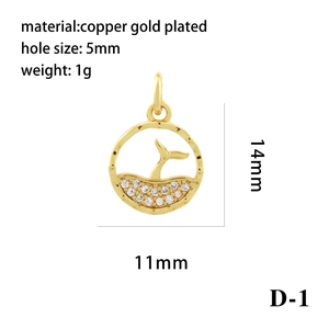 Macro detail of 14mm gold-plated whale tail charm with zircon inlays and dimensions