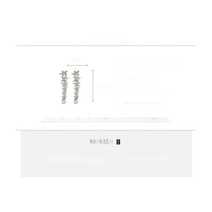 Detail view of long silver fringe star earrings with alloy and rhinestone specifications