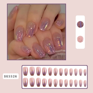Macro detail of gradient purple glitter press-on nails with golden star sequins set
