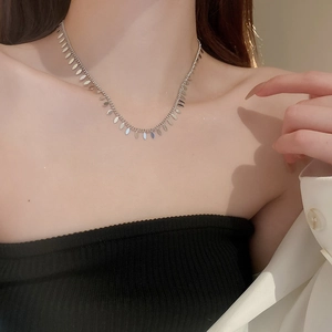 Minimalist silver leaf sequin tassel choker necklace for women with metallic luster